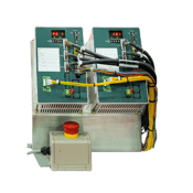 A green and tan PLC with yellow and black wires connected.